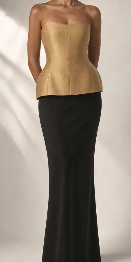 Gold peplum top and black skirt made from a VD Textile Studio fabric