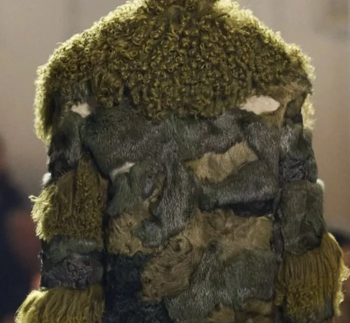 Patchwork fur coat detail with mixed earthy textures
